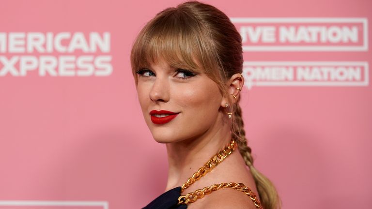 FILE PHOTO: Singer Taylor Swift arrives on the red carpet for the "Billboard Women in Music" event in Los Angeles, California, U.S., December 12, 2019. REUTERS/Mike Blake/File Photo
