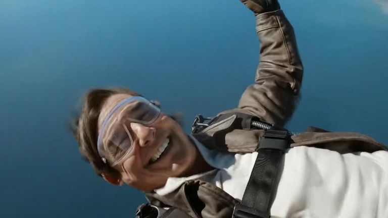 Tom Cruise thanks fans and wishes them a happy holiday while skydiving