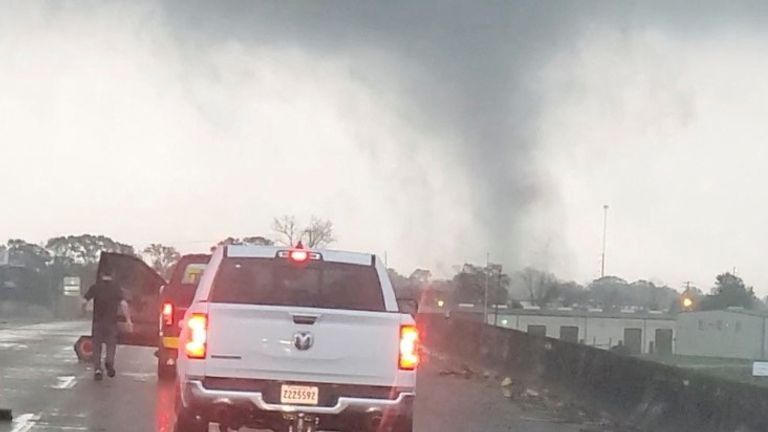 A tornado passes a highway in New Iberia, Louisiana, U.S., December 14, 2022, in this still image obtained from social media video. Mike Ibert/via REUTERS THIS IMAGE HAS BEEN SUPPLIED BY A THIRD PARTY. MANDATORY CREDIT. NO RESALES. NO ARCHIVES.