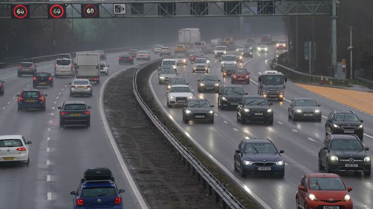 Traffic on the M42 near Birmingham. Many drivers are battling a band of heavy rain which is moving north from southern England and Wales to southern Scotland and Northern Ireland throughout the day. Picture date: Friday December 23, 2022.
