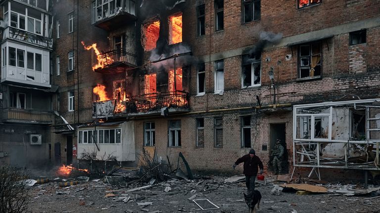 A local resident leaves his home after Russian shelling destroyed an apartment house in Bakhmut, Donetsk 
PIC:AP