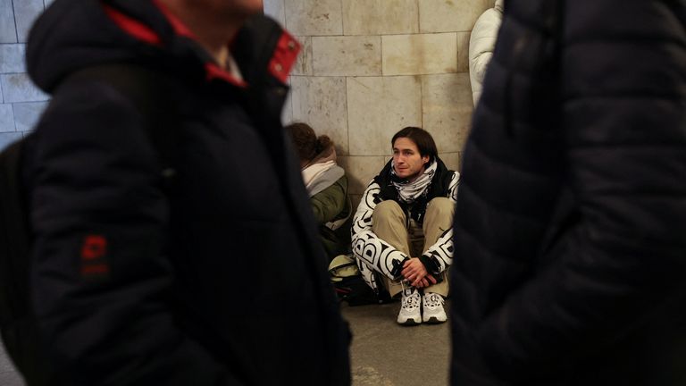 People take shelter inside the metro station amid Russian missile attacks in Kyiv, Ukraine December 5, 2022. REUTERS/Shannon Stapleton