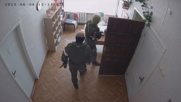 The chilling footage shows armed men walking through the orphanage 