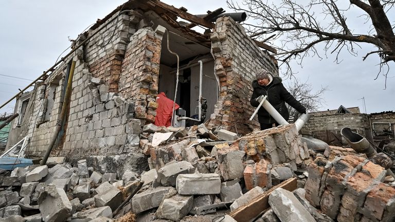 A local resident, Liubov Onyschenko, is seen near her house heavily damaged by a Russian missile strike, amid Russia's attack on Ukraine, in the village of Kupriianivka, Zaporizhzhia region, Ukraine