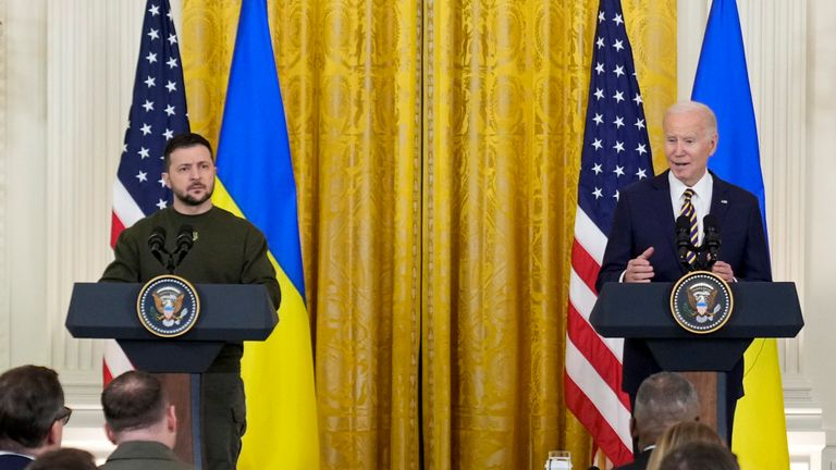 Ukrainian President Volodymyr Zelenskyy listens as President Joe Biden speaks during a news conference in the East Room of the White House in Washington, Wednesday, Dec. 21, 2022. (AP Photo/Andrew Harnik)