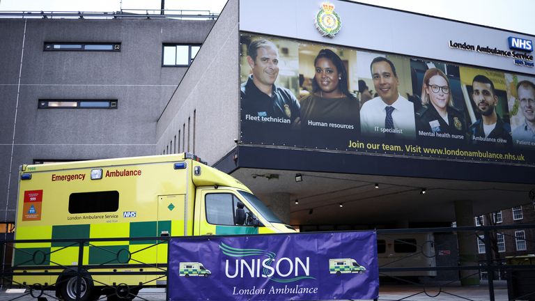 A Unison sign is displayed outside NHS London Ambulance Service in London 