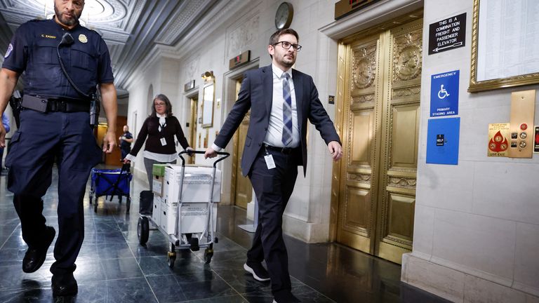 U.S. Capitol Police escort U.S. House Ways and Means Committee staff to deliver boxes of documents after a committee meeting to discuss former President Donald Trump's tax returns on Capitol Hill in Washington, U.S., December 20, 2022.REUTERS/Evelyn Hawkstein