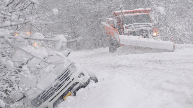 A state plow truck clears snow along Route 30 in Jamaica, Vermont (Christopher Radder/The Brattleboro Reformer via AP)