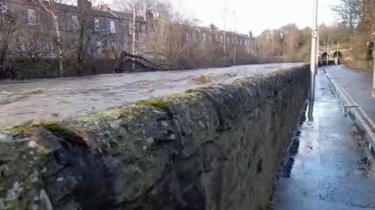 Heavy rain makes Water of Leith flow quickly and near the top of the defences in Edinburgh