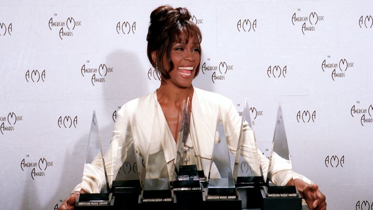 Whitney Houston with her seven awards at the 21st annual American Music Awards in Los Angeles, February 1994. Pic: AP /Douglas Pizac

