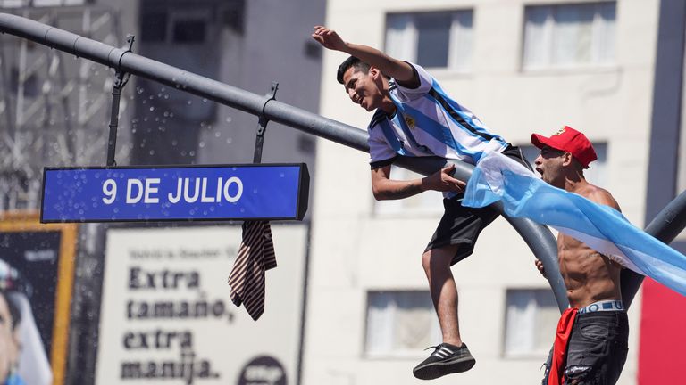 Argentina football fans celebrate their team's World Cup win over France, in Buenos Aires, Argentina, Sunday, December 18, 2022. (AP Photo/Matilde Campodonico)