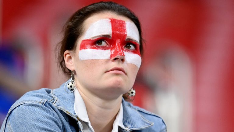 A fan looks glum as England are eliminated from the World Cup 