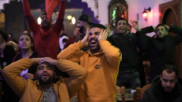 Morocco fans react as they watch the semifinal match against France in the World Cup, in Barcelona, Spain Wednesday, Dec. 14, 2022. (AP Photo/Emilio Morenatti)
