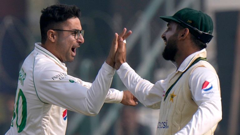 Pakistan&#39;s Abrar Ahmed, center, celebrates with teammate after taking the wicket of England&#39;s Zak Crawley during the first day of the second test cricket match between Pakistan and England, in Multan, Pakistan, Friday, Dec. 9, 2022. (AP Photo/Anjum Naveed) 