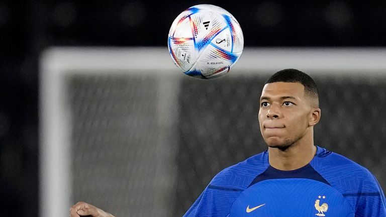 France&#39;s Kylian Mbappé eyes the ball during a training session in Doha, Qatar, Saturday, Dec. 3, 2022, on the eve of the World Cup soccer match between France and Poland. (AP Photo/Christophe Ena)