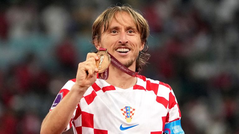 Luka Modric shows off his bronze medal after Croatia beat Morocco in the World Cup third-place playoff