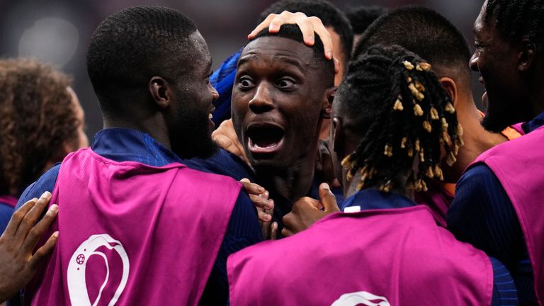 Randal Kolo Muani celebrates with team-mates after doubling France&#39;s lead