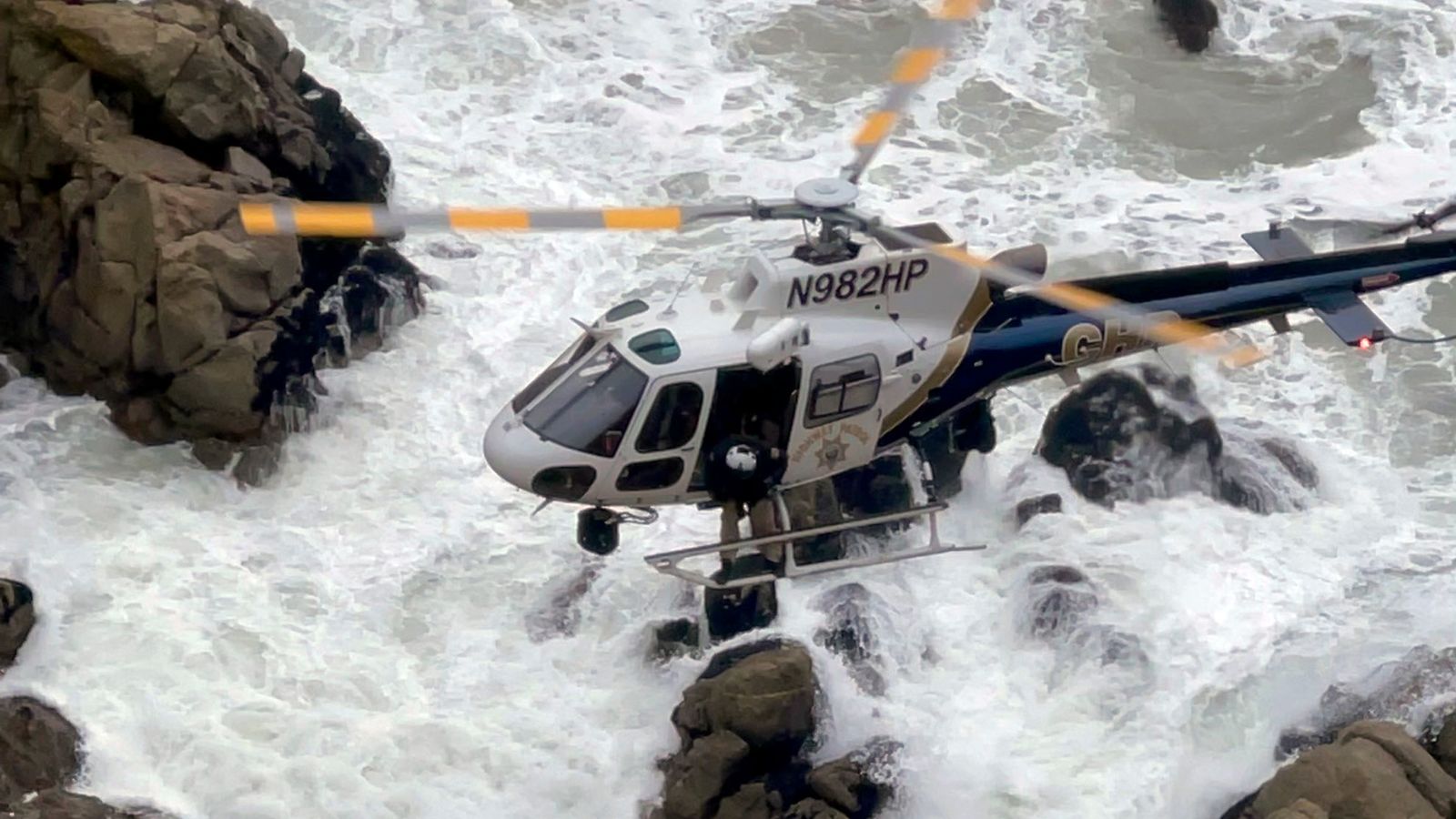 Two adults and two children survive after Tesla plunges 75m off cliff along Pacific Coast