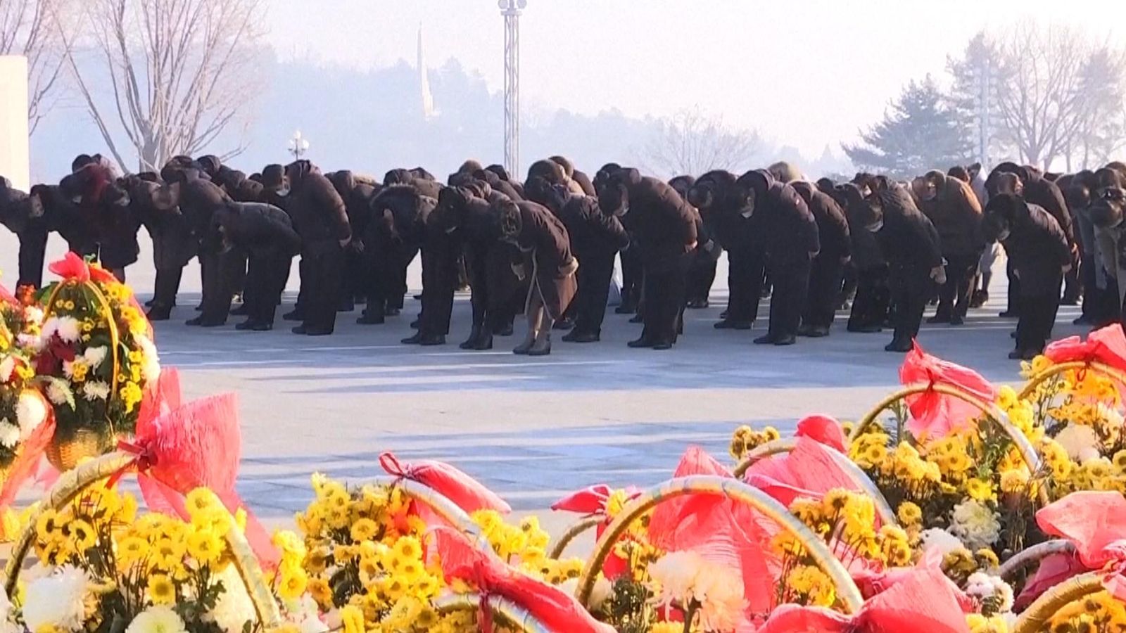 New Year's Day in North Korea sees ritual flower laying and bowing to