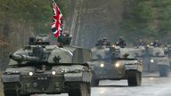 A convoy of Challenger Two tanks drive along a road during media day at.the British army training ground near the northern German town of Belsen  