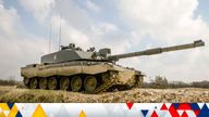 A Challenger II Main Battle Tank takes part in live firing at Lulworth Gunnery Range, Dorset