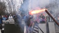 Demonstrators throw Molotow cocktails and fireworks at police officers, during a protest against the expansion of the Garzweiler open-cast lignite mine of Germany&#39;s utility RWE in Luetzerath 