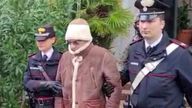 Matteo Messina Denaro the country&#39;s most wanted mafia boss being escorted out of a Carabinieri police station after he was arrested in Palermo, Italy