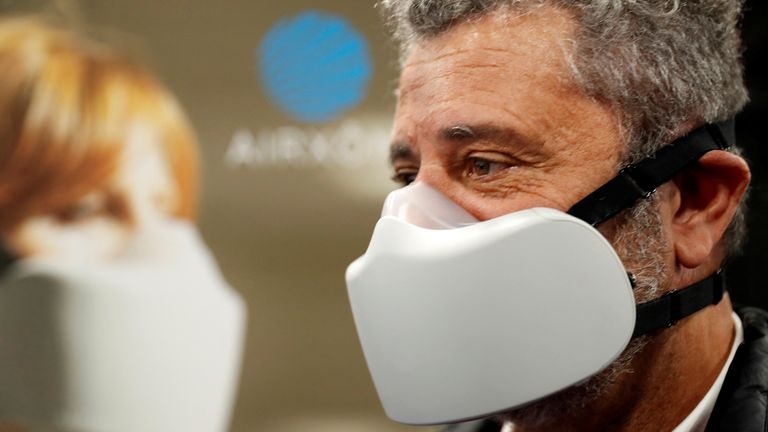 Gaston Vincent mocks up during the CES unveiling press conference at the annual consumer electronics trade show CES 2023 in Las Vegas, Nevada, U.S., January 3, 2023. Airxom mask, the first active device for respiratory protection.REUTERS/Steve Marcus