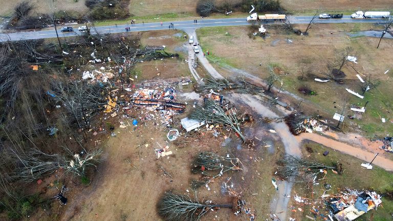 Devastation is seen in the aftermath from severe weather, Thursday, Jan. 12, 2023, in Greensboro, Ala. A giant, swirling storm system billowing across the South spurred a tornado on Thursday that shredded the walls of homes, toppled roofs and uprooted trees. (Mike Goodall via AP)