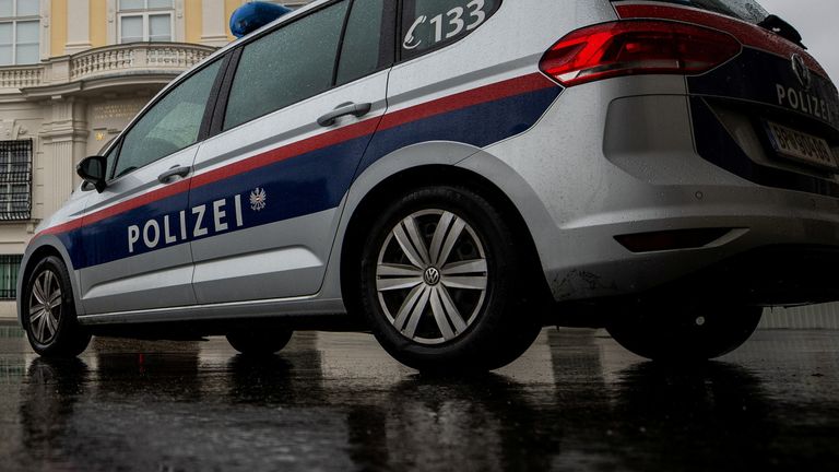 A police car parks in front of the Austrian federal chancellery in Vienna, Austria October 7, 2021. REUTERS/Lisi Niesner