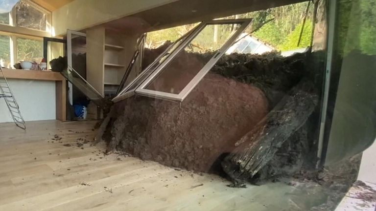 Earth forces its way into a house in a landslide in California