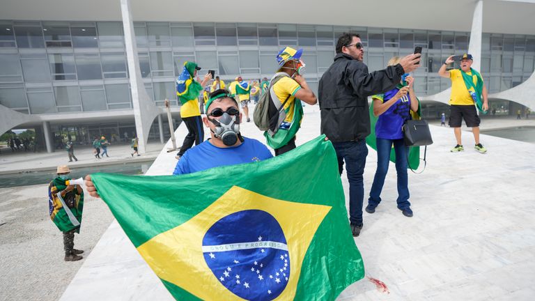 supporters of Brazil&#39;s former President Jair Bolsonaro, storm the the National Congress building in Brasilia