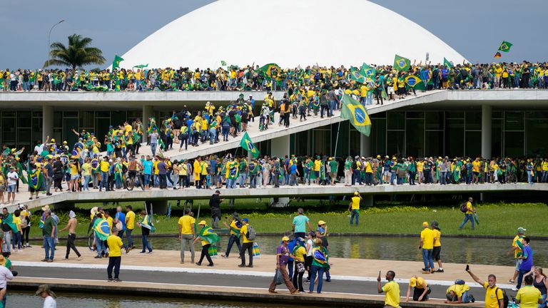 Protesters, supporters of Brazil&#39;s former President Jair Bolsonaro, storm the the National Congress building in Brasilia. Pic: AP