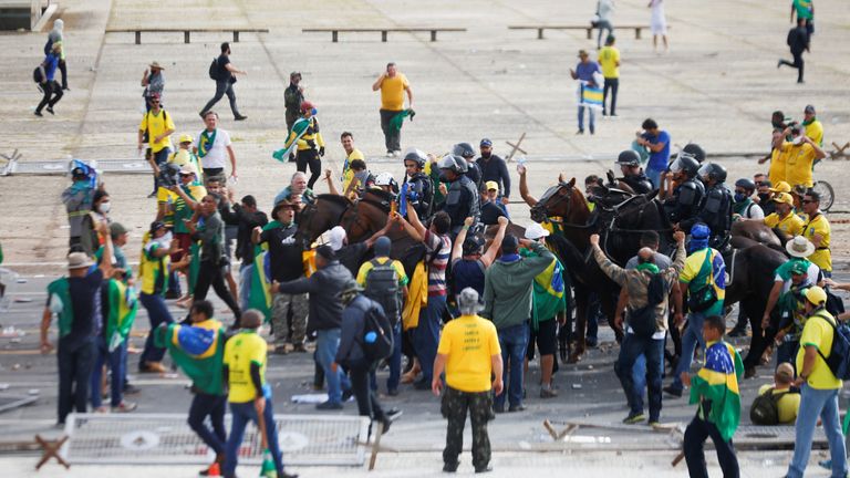 Supporters of Brazil&#39;s former President Jair Bolsonaro clash with security forces