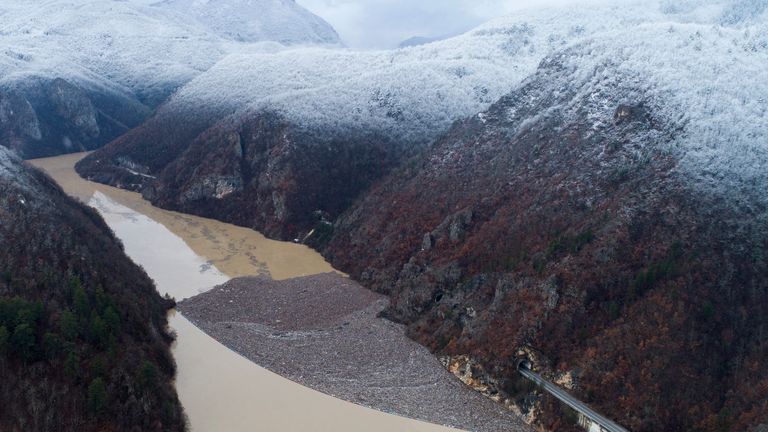 Aerial view of waste floating in the Drina river near Visegrad, Bosnia, Friday, Jan. 20, 2023. Tons of waste dumped in poorly regulated riverside landfills or directly into the rivers across three Western Balkan countries end up accumulating during high water season in winter and spring, behind a trash barrier in the Drina River in eastern Bosnia. (AP Photo/Armin Durgut)