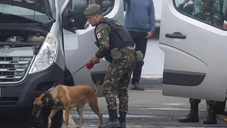 A security officer inspects a vehicle at the parking lot of Brazil&#39;s National Congress ahead the inauguration ceremony of President-elect Luiz Inacio Lula da Silva on January 1, in Brasilia, Brazil December 31, 2022. REUTERS/Ricardo Moraes
