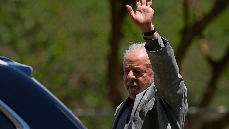 Brazil&#39;s President-elect Luiz Inacio Lula da Silva waves to a crowd as he leaves a meeting where he announced the ministers for his incoming government, in Brasilia, Brazil, Thursday, Dec. 29, 2022. Lula will be sworn-in on Jan. 1, 2023. (AP Photo/Eraldo Peres)