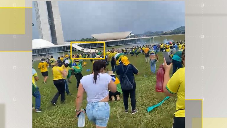 Minutes after the barriers were initially breached, protesters had begun climbing the roof of Brazil&#39;s Congress. Pic: Facebook