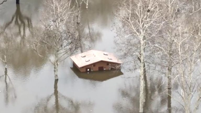 Homes submerged as deadly storms hit California