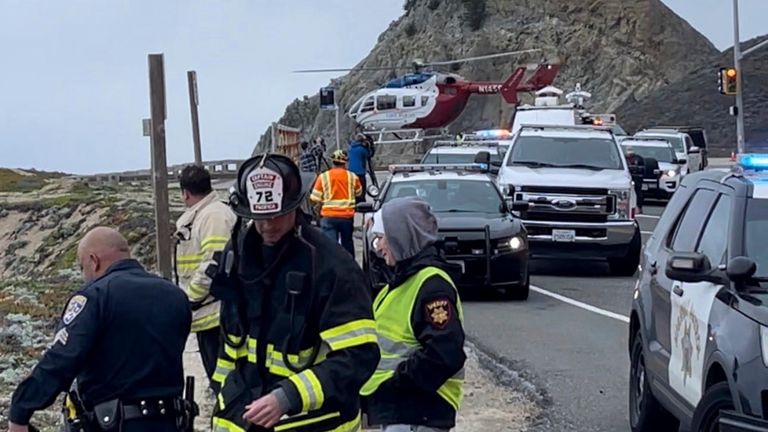 In this image from video provided by San Mateo County Sheriff&#39;s Office, emergency personnel respond after a Tesla plunged off a Northern California cliff along the Pacific Coast Highway, Monday, Jan. 2, 2023, near an area known as Devil&#39;s Slide, leaving four people in critical condition, a fire official said. (San Mateo County Sheriff&#39;s Office via AP)