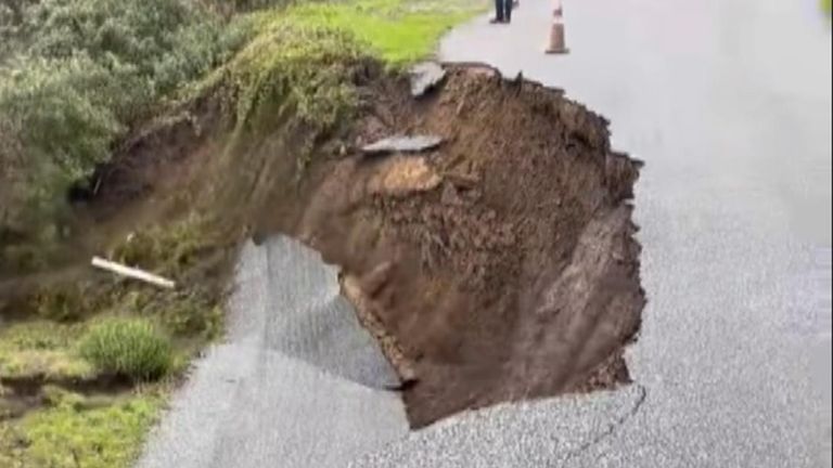 Road crumbles away in California after heavy rain