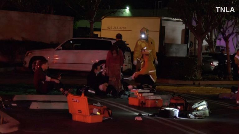 A screenshot from a video shows emergency responders working at the scene of a shooting in Monterey Park, California, U.S., January 22, 2023. TNLA/Handout from Reuters