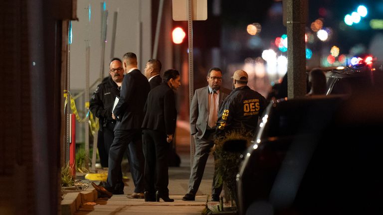 Investigators gather at the scene of a shooting in Monterey Park, Calif., on Sunday, Jan. 1.  February 22, 2023. Dozens of officers responded to a shooting Saturday night after a large Lunar New Year celebration in an East Los Angeles neighborhood.  (AP Photo/Jae C. Hong)