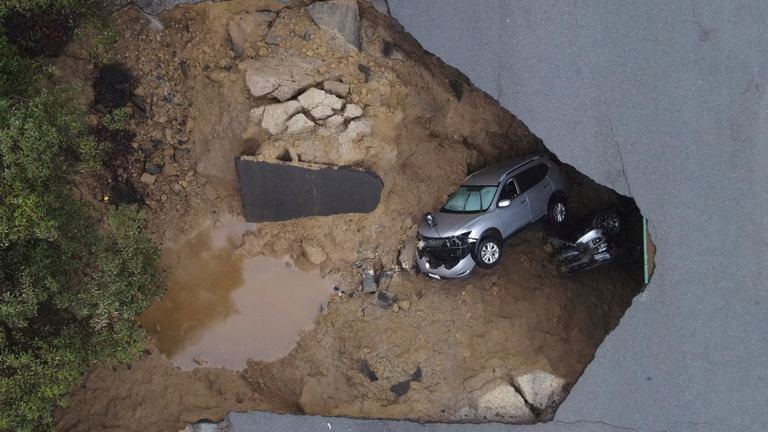 Several people had to be rescued after two vehicles fell into a sinkhole in California