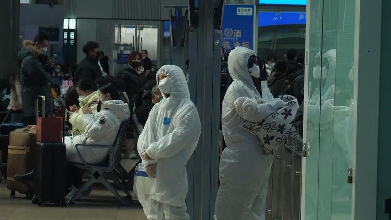 Some people dressed in white hazmat suits for Lunar New Year celebrations in China 