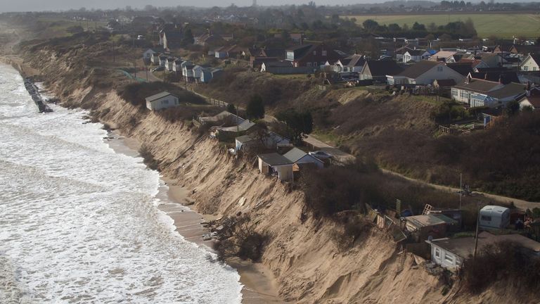 Homes at risk by the coast. Pic: PA