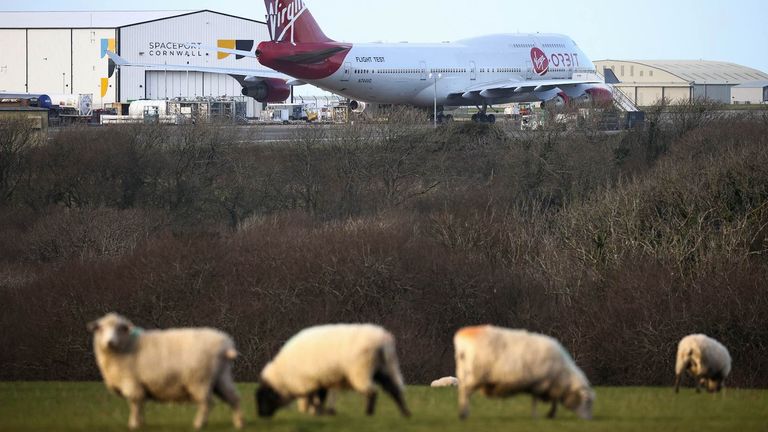 Cosmic Girl, a Virgin Boeing 747-400 aircraft sits on the tarmac with Virgin Orbit&#39;s LauncherOne rocket attached to the wing, ahead of the first UK launch tonight, at Spaceport Cornwall at Newquay Airport in Newquay, Britain, January 9, 2023. REUTERS/Henry Nicholls