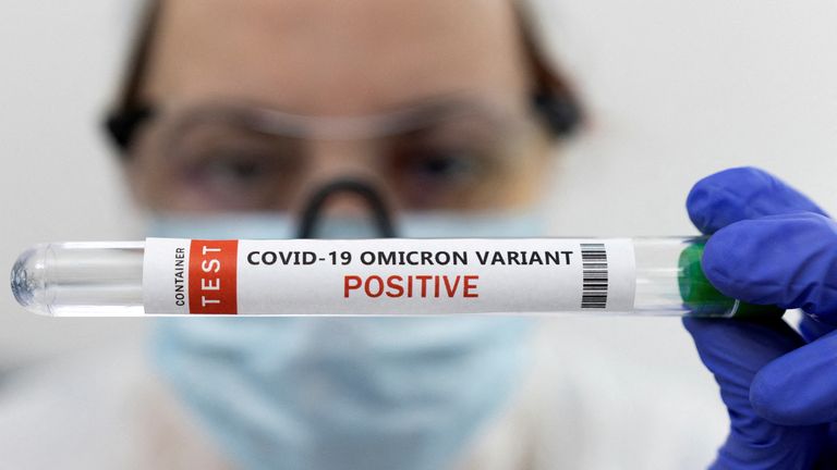 Test tube labelled "COVID-19 Omicron variant test positive"