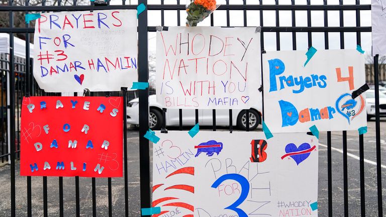 Signs sit along a fence outside UC Medical Center where Buffalo Bills safety Damar Hamiln remains hospitalized, Thursday, Jan. 5, 2023, in Cincinnati. Damar Hamlin has shown what physicians treating him are calling ...remarkable improvement over the past 24 hours,... the team announced in a statement on Thursday, three days after the player went into cardiac arrest and had to be resuscitated on the field. (AP Photo/Joshua A. Bickel)