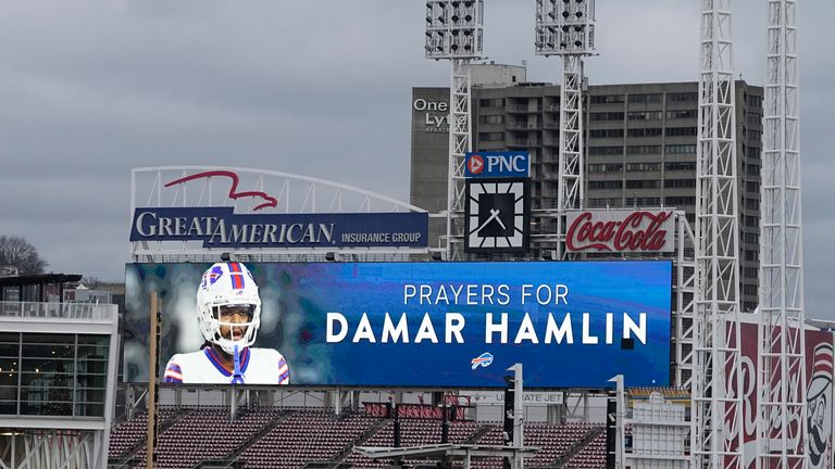 A scoreboard at Great American Ballpark displays a photo of Buffalo Bills&#39; Damar Hamlin, Tuesday, Jan. 3, 2023, in Cincinnati. Hamlin was taken to the University of Cincinnati Medical Center after collapsing on the field during an NFL football game against the Cincinnati Bengals on Monday night.(AP Photo/Darron Cummings)